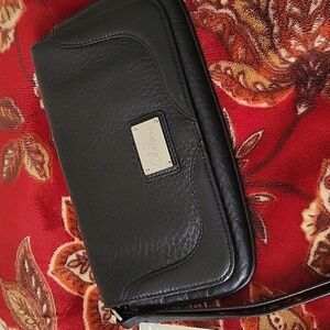 Cole Haan black leather wristlet.